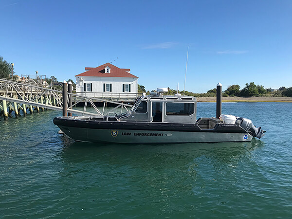 a law enforcement boat at a dock
